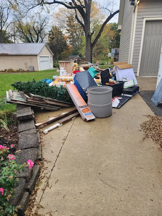 Dumpster being loaded with debris for Roofing Dumpster Rental in Egg Harbor City